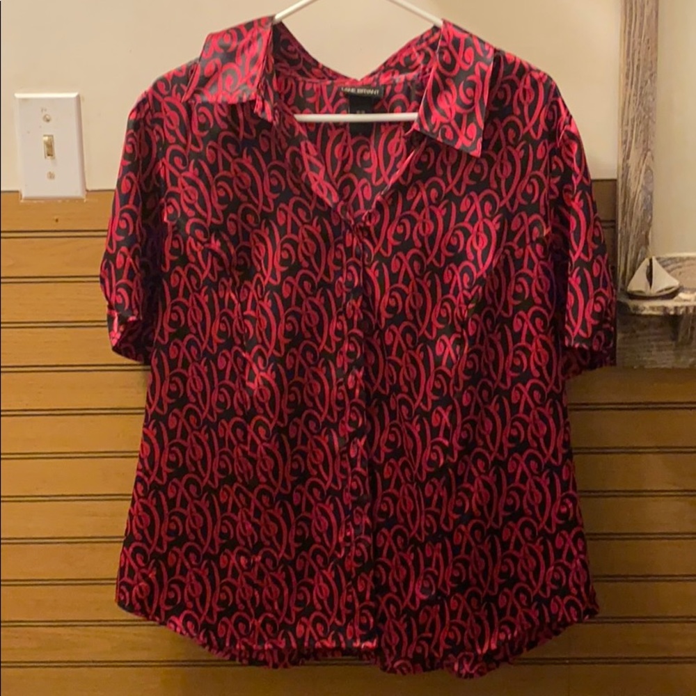A silky, pink and black, short sleeved blouse